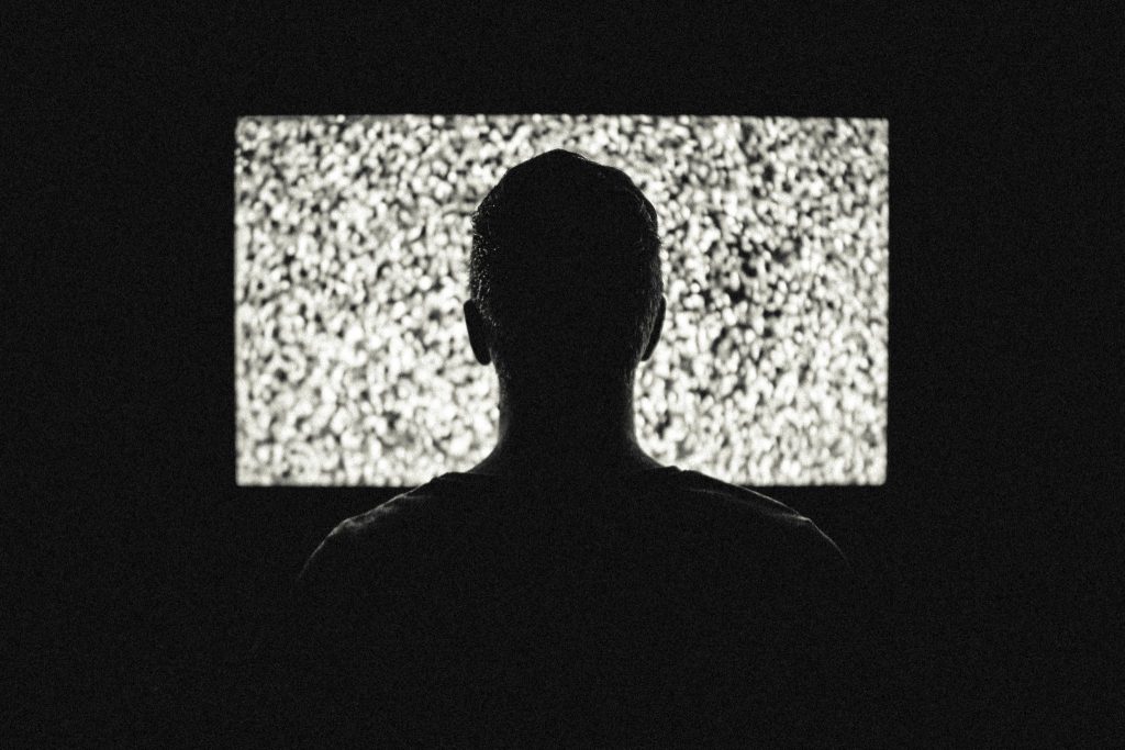 man watching TV